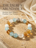 The Taurus Throne crystal bracelet with aquamarine 
cat's eye gold rutilated quartz and clear quartz beads, 
Taurus zodiac healing jewelry on dark green velvet surface