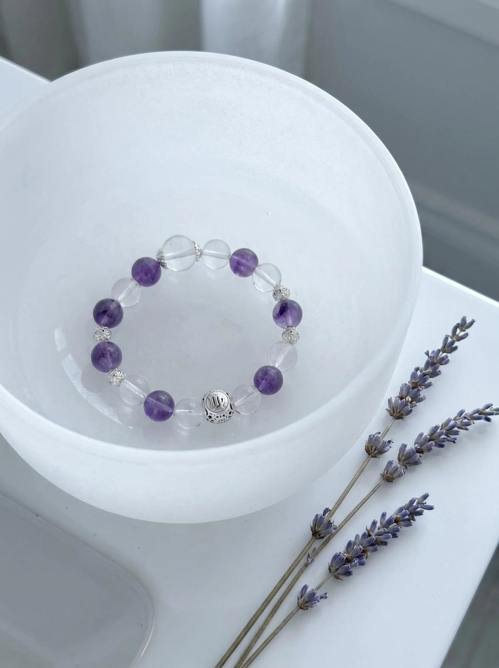 Virgo Oracle crystal bracelet on selenite charging plate 
with white sage bundle and amethyst geode, 
virgo zodiac crystal cleansing ritual
