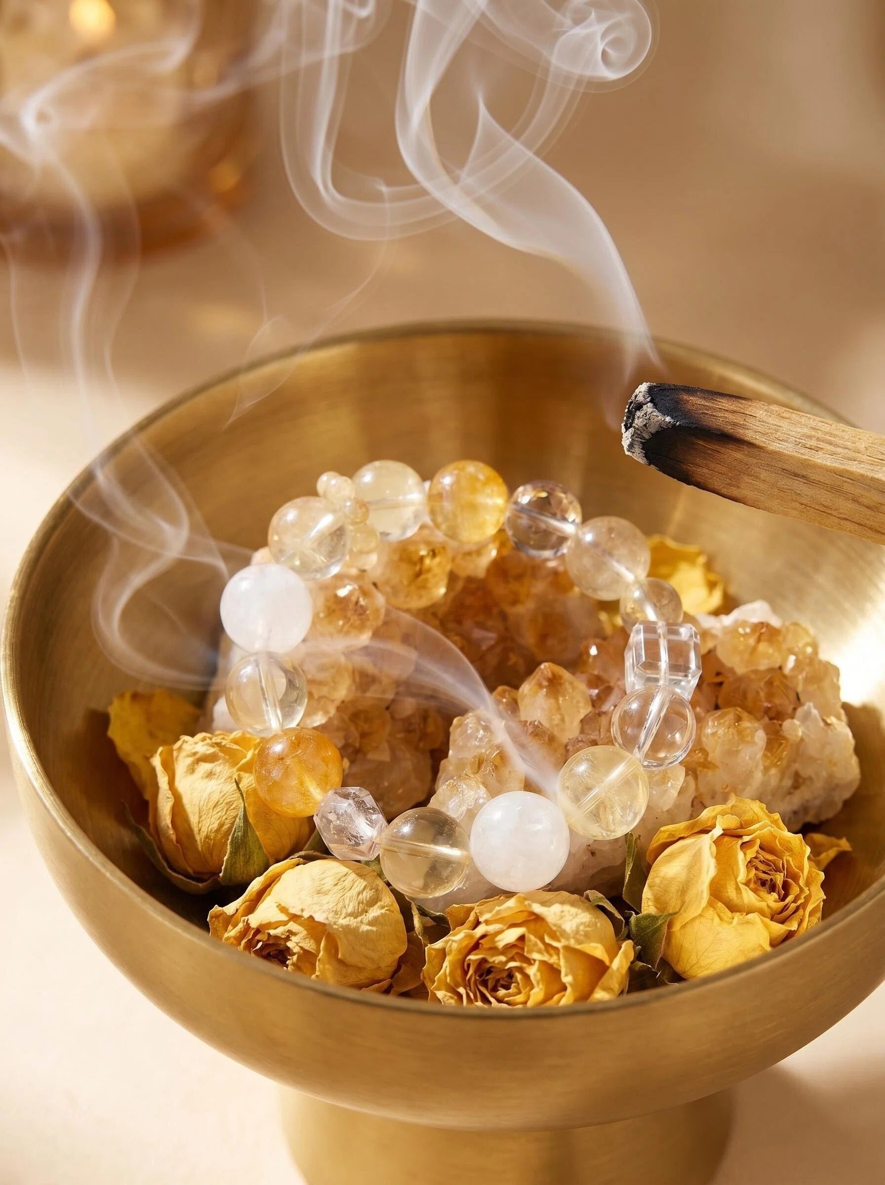 Golden Drift yellow fluorite and phantom quartz bracelet
on selenite charging plate with palo santo,
wealth crystal bracelet cleansing ritual golden tones