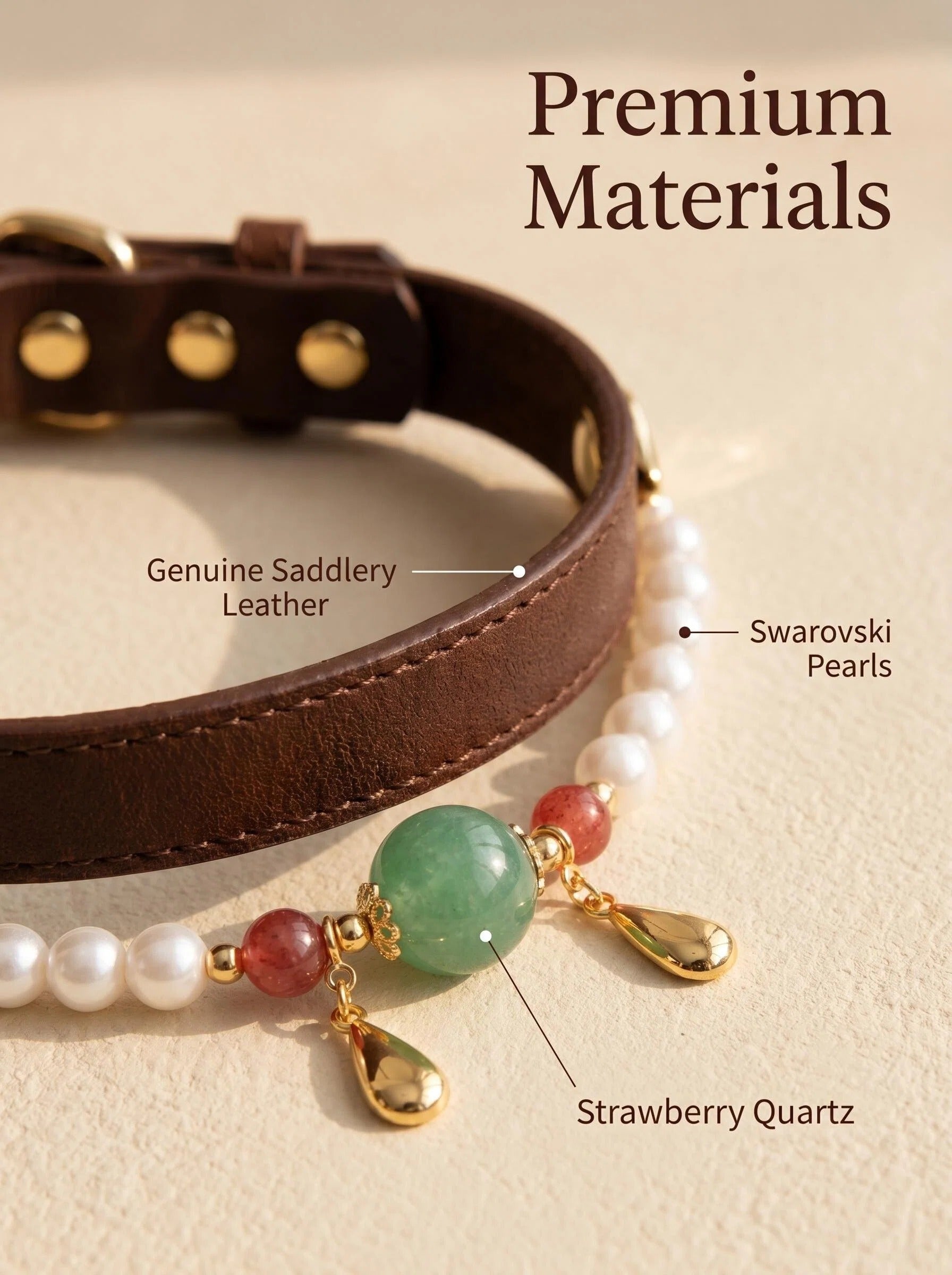 Close-up of Pearl & Bloom pet collar showing
Swarovski pearl red strawberry quartz green pendant
and gold hardware detail,
luxury crystal pet jewelry close-up