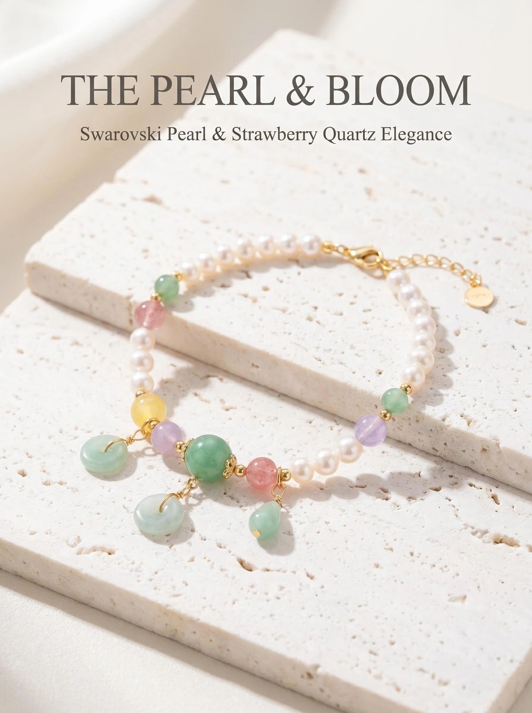 The Pearl & Bloom crystal bracelet with Swarovski shell pearl
red and green strawberry quartz beads
and green teardrop pendant,
heart chakra grace and magnetism bracelet
on white silk surface