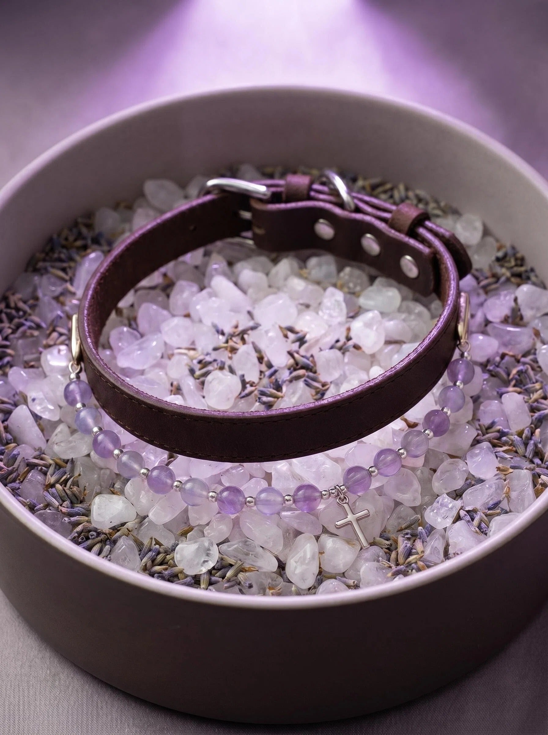 Sacred Light pet collar on selenite charging plate
with palo santo and lavender,
spiritual crystal pet collar cleansing ritual
purple and silver tones
