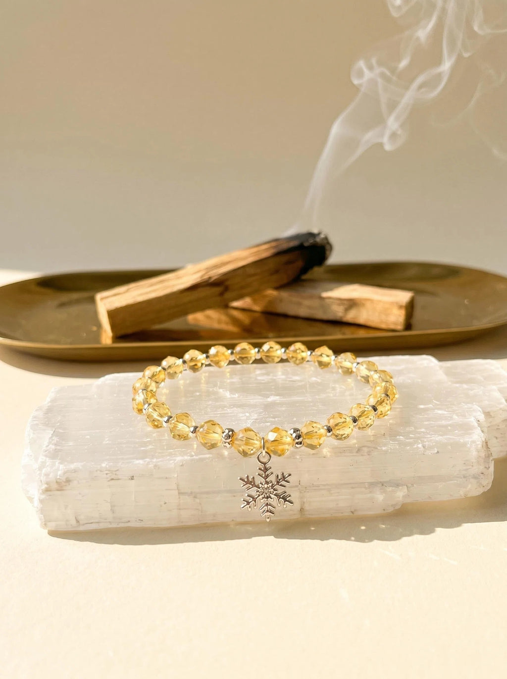 Solar Guardian pure lemon citrine bracelet
on selenite charging plate with palo santo,
citrine crystal bracelet cleansing ritual golden tones