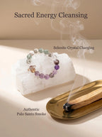 Sovereign Ascent amethyst kunzite and super seven bracelet
on selenite charging plate with palo santo smoke,
high frequency crystal bracelet cleansing ritual