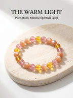 The Warm Light crystal bracelet with strawberry quartz
orange moonstone and amber beads,
emotional nourishment healing bracelet
on warm cream linen surface
