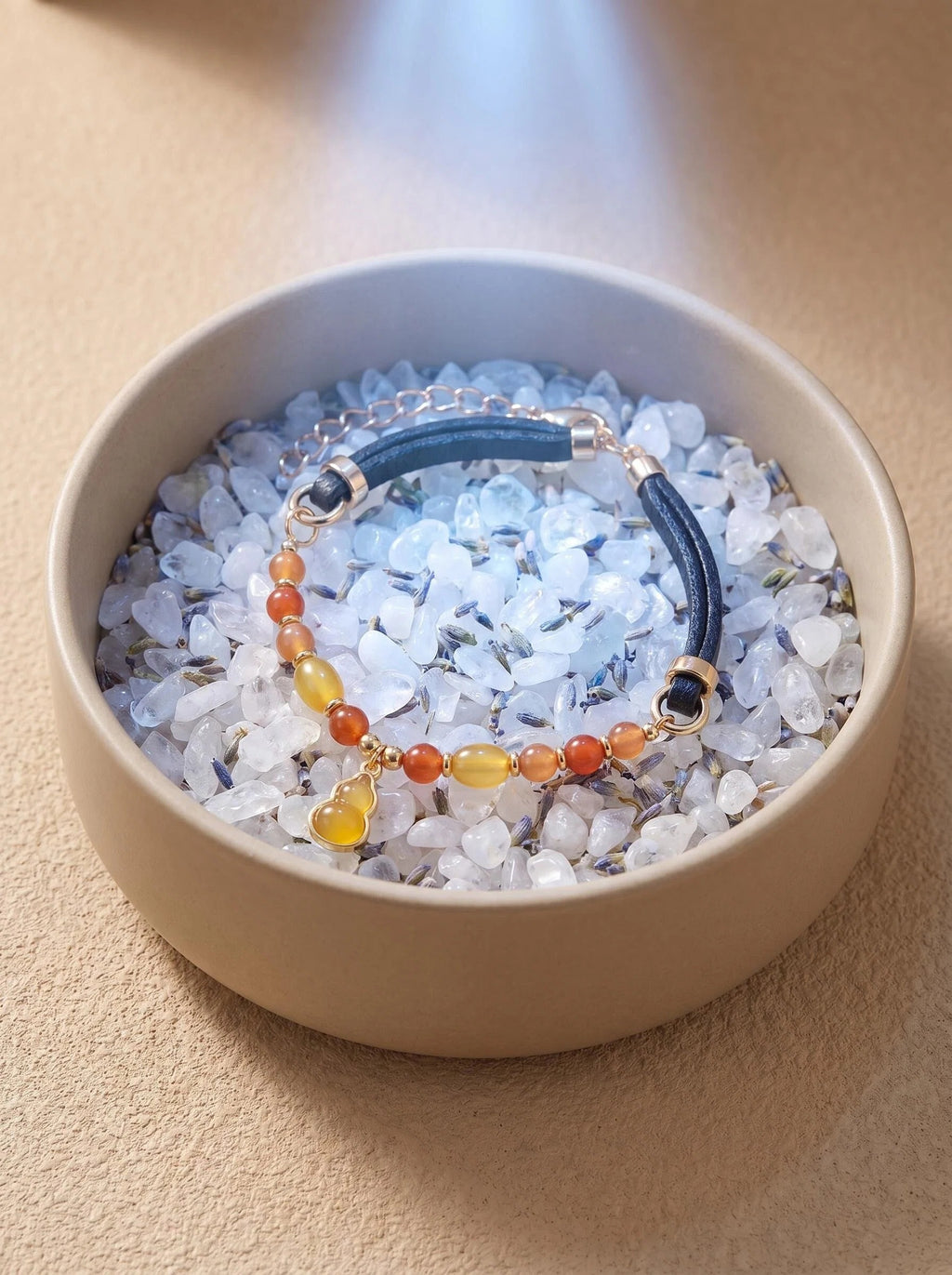 Warm Light pet collar on selenite charging plate
with palo santo and amber piece,
crystal pet collar cleansing ritual warm golden tones
